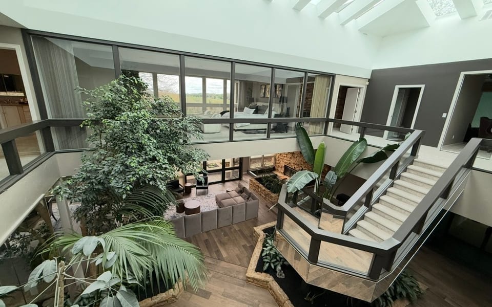 Atrium with skylights and indoor plants at Serenity at Spring Hill