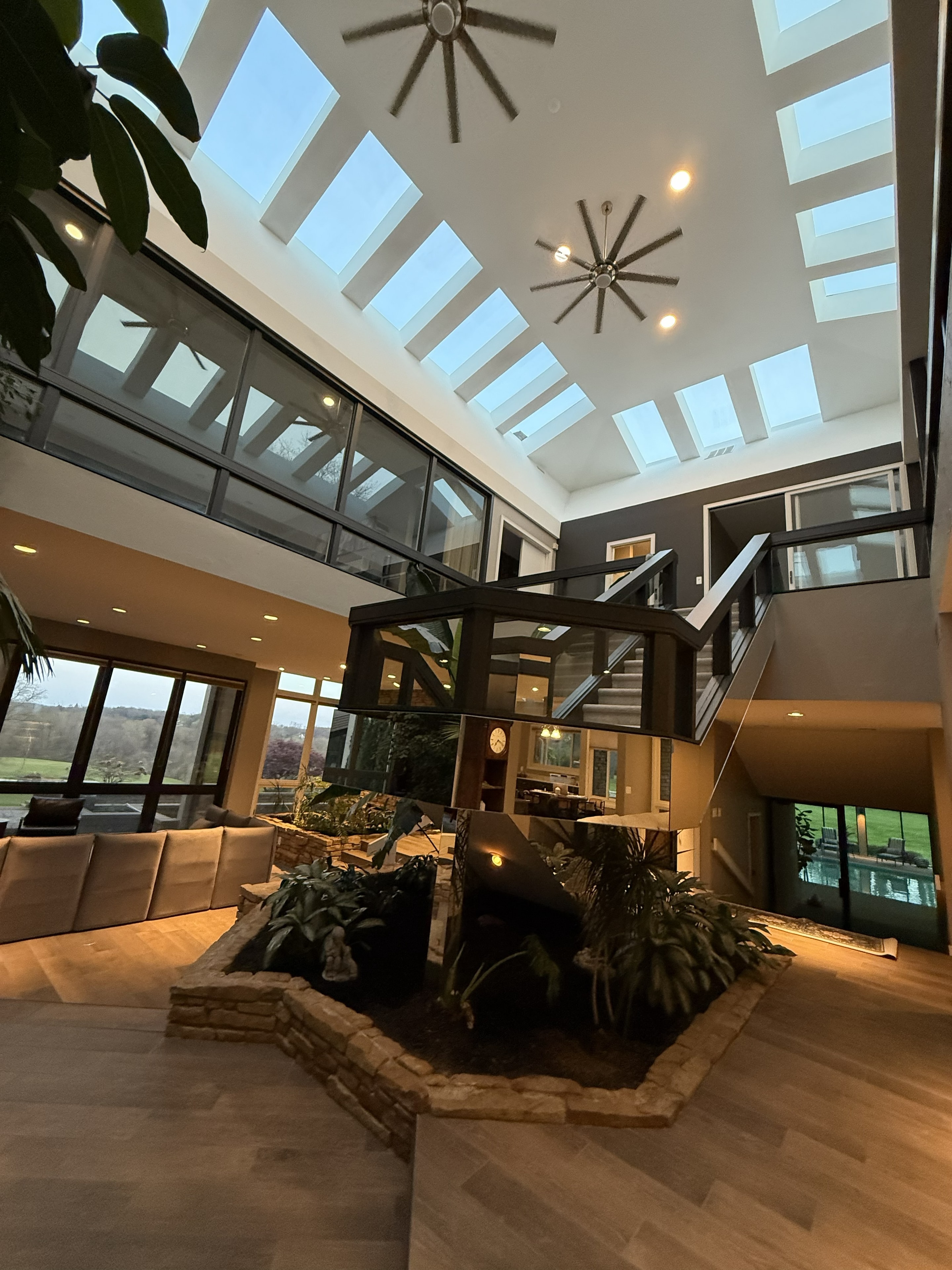 Atrium with indoor plants and natural light at Serenity at Spring Hill