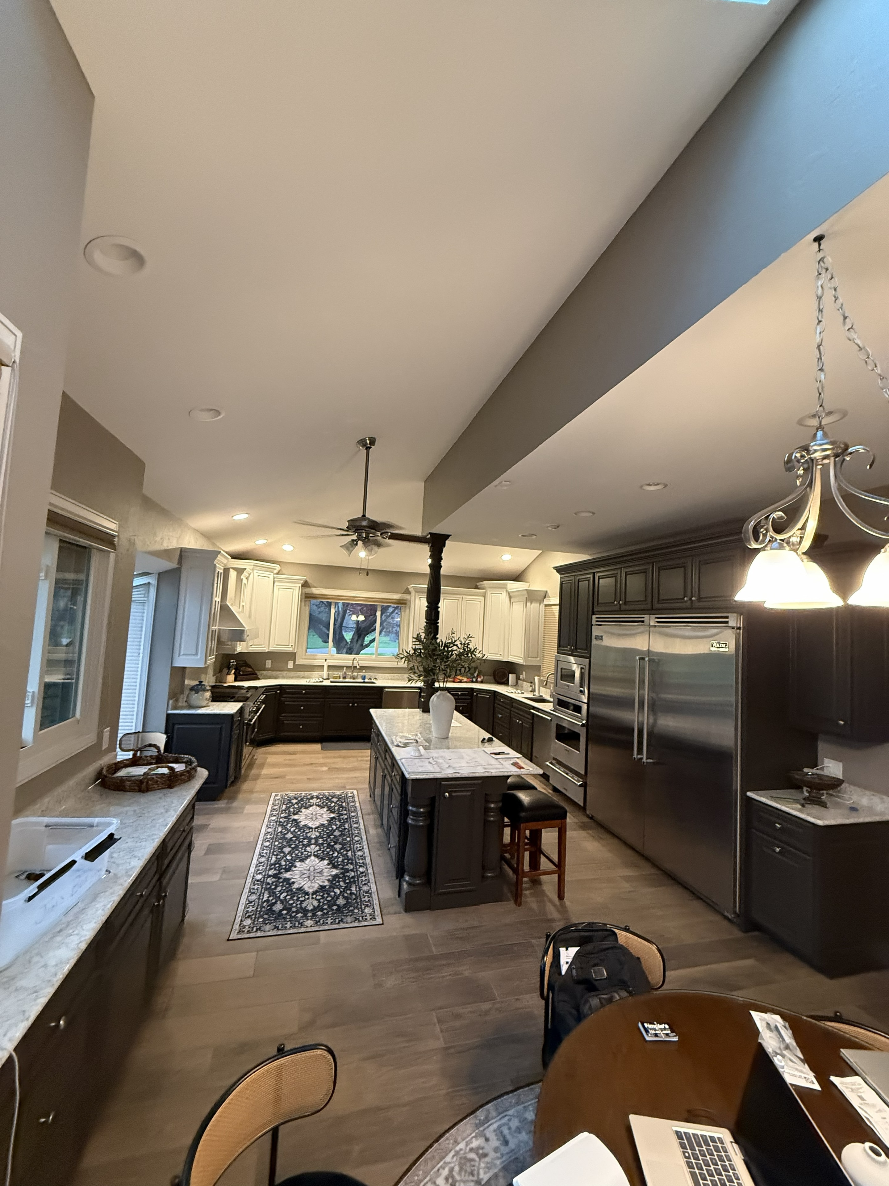 Gourmet kitchen with dark cabinetry